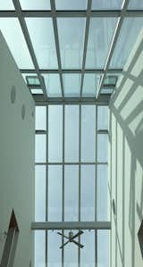 Looking up through glass ceiling/skylight over stairway