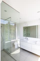 Bath Room, One Piece Toilet, Porcelain Tile Floor, Ceiling Lighting, Undermount Sink, Engineered Quartz Counter, Open Shower, Porcelain Tile Wall, and Recessed Lighting Bathroom  Photo 10 of 12 in Magnolia Guest House by E. Cobb Architects