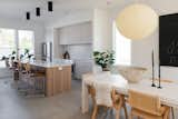 Kitchen, Ceramic Tile Backsplashe, Range, Ceramic Tile Floor, Quartzite Counter, and Refrigerator Entryway opens into dining and kitchen  Photo 5 of 18 in Contemporary Infill in South Carolina