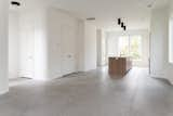 Kitchen, Quartzite Counter, Wood Cabinet, Ceiling Lighting, and Ceramic Tile Floor Finished product without staging  Photo 13 of 18 in Contemporary Infill in South Carolina by Ashley James