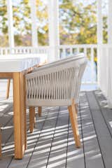 The outdoor table and chairs by Williams Sonoma are durable and comfortable, providing a convenient place to entertain and enjoy the evening hours by the water. 