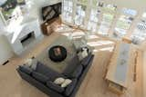 A key move in the space was to refinish all of the existing red oak floors to a lighter, more neutral tone that both lighten and modernize the open living area. 