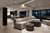 Living Room, Ceiling Lighting, Sofa, Light Hardwood Floor, Standard Layout Fireplace, Recessed Lighting, and Chair  Photo 4 of 17 in Sunridge House by Conrad Asturi Studios