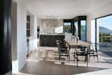 Dining Room, Light Hardwood Floor, Table, Chair, Recessed Lighting, and Ceiling Lighting  Photo 5 of 17 in Sunridge House by Conrad Asturi Studios