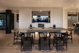 Dining Room, Light Hardwood Floor, Recessed Lighting, Table, Ceiling Lighting, Bar, and Storage  Photo 6 of 17 in Sunridge House by Conrad Asturi Studios
