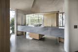 Primary suite custom stone double sinks with keystone details, recessed lighting behind mirror