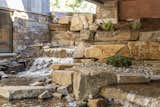 Outdoor and Garden Rustic lodge vibes, covered front entry, exterior design. Sustainable, natural materials, biophilic design. Skyway bridge over waterfall, luxury water feature.  Photo 9 of 101 in Modern Montana by JMAD