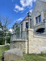 Castle terrace. Custom railing and lampposts. Outdoor living area.  Photo 11 of 359 in Huntington Manor by JMAD