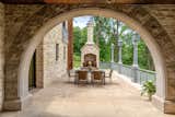 Stone home outdoor living space. Outdoor dining area. 