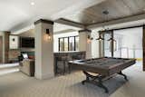 Lower level entertainment room, billiard, hockey rink, home theater, wood ceiling.