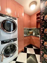 Laundry room, pink cabinets.