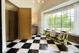 Master suite, luxurious bathroom, custom vanity, vaulted ceilings, freestanding tub, checkered floor tile, custom shower.