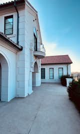 Stunning home entry. Exterior design details. Baroque balcony.