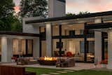 Modern home exterior architecture. Patio, fire pit, water feature, outdoor living space.