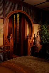 Rice paper walls, detailed doorway with hand-carved Chinese dogs.