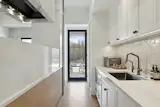 Hidden scullery kitchen for an organized living space.