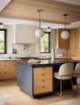 Modern Kitchen, White oak cabinets, kitchen island, wood ceiling, zellige tile, tiled hood, black windows
