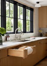 kitchen, black windows, sink, kitchen sink, paper towel holder, marble countertops, paper towel drawer