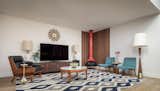 Living Room, Floor Lighting, Table, Corner Fireplace, Coffee Tables, Table Lighting, Vinyl Floor, Media Cabinet, Lamps, Accent Lighting, Recessed Lighting, and Chair Living Room  Photo 13 of 31 in Midcentury Lafayette by Alina Druga Interiors