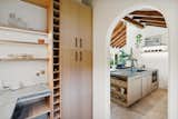 Pantry with adjustable wine rack with option for storing vertical items like cutting boards  Photo 8 of 18 in Casa Serena by The Nature Studio