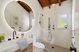 Bath Room, Vinyl Floor, Wall Lighting, Pendant Lighting, One Piece Toilet, Porcelain Tile Floor, Concrete Counter, Concrete Wall, Vessel Sink, Accent Lighting, and Open Shower Full Bath  Photo 11 of 18 in Casa Serena by The Nature Studio