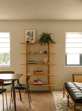 Separating the dining and living rooms are the Skyladder Shelves by Ariake which showcase ceramics by MCeramics custom made for the project and artwork by Jessalyn Brooks (Placemeant Gallery, NYC). 