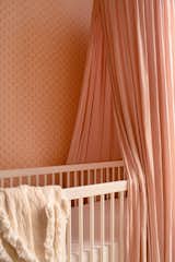 Liewood dusty pink canopy.  Marmaris Coral wallpaper by Rebel Walls. 