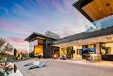 Outdoor, Desert, Back Yard, Large Patio, Porch, Deck, Concrete Patio, Porch, Deck, Hardscapes, and Infinity Pools, Tubs, Shower Views of outdoor patio bar, kitchen, lounge area, and pool.  Photo 11 of 15 in Big Girl House by Tate Studio Architects