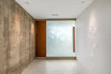 Hallway and Porcelain Tile Floor Entry foyer.  Photo 3 of 16 in Minimalist Impact by Tate Studio Architects