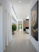 Hallway and Porcelain Tile Floor Gallery view.  Photo 4 of 16 in Minimalist Impact by Tate Studio Architects