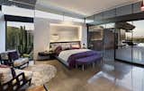 Bedroom, Recessed Lighting, Bench, Bed, Chair, and Concrete Floor Primary bedroom.  Photo 7 of 18 in Curve Appeal by Tate Studio Architects