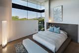 Bedroom, Concrete Floor, Bench, and Bed Guest bedroom.  Photo 9 of 18 in Curve Appeal by Tate Studio Architects