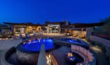 Overall exterior evening pool view.