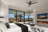 Bedroom, Bed, and Chair Primary bedroom with window wall.  Photo 11 of 20 in Desert Haven by Tate Studio Architects