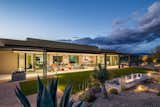 Outdoor, Hardscapes, Desert, Back Yard, Raised Planters, and Large Patio, Porch, Deck Back exterior evening view.  Photo 18 of 20 in Desert Haven by Tate Studio Architects