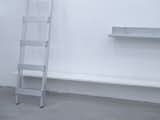 Plastic and metal shelves as display devices. Sauna-System pieces as objectual features. 