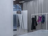 The store's architectural and display elements, seamlessly integrated, reconfigure the space from both functional and exhibition standpoints.