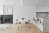 Dining Room, Gas Burning Fireplace, Recessed Lighting, Chair, Marble Floor, Table, Standard Layout Fireplace, and Light Hardwood Floor open concept living/dining space  Photo 3 of 12 in Bay Street Townhouse by Architecture Riot