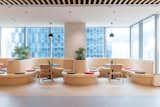 Office, Vinyl Floor, Lamps, Chair, Desk, Plywood Floor, Slate Floor, Study Room Type, Craft Room Room Type, and Library Room Type Collaboration Area  Photo 1 of 5 in Ricoh HK by Elaine Tang