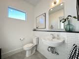 Bath Room, Subway Tile Wall, Porcelain Tile Floor, and Wall Mount Sink Guest / Pool Bath  Photo 19 of 49 in Eco-Conscience "Portuguese Farmhouse" by Jon Wunsch