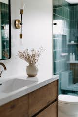 Bath Room, Undermount Sink, Engineered Quartz Counter, Enclosed Shower, Porcelain Tile Wall, and Two Piece Toilet  Photo 6 of 13 in Clean lines with a retro spin by Jill Lamphier