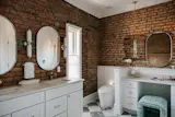 Primary Bathroom with gorgeous Exposed Brick
