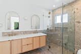 Bath Room, Concrete Floor, Ceramic Tile Wall, Recessed Lighting, One Piece Toilet, Wall Lighting, and Enclosed Shower Detailed Bathroom   Photo 2 of 6 in Costa Mesa Home, Reimagined by OC Builders Group