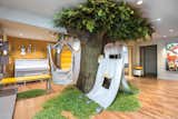 Tree with sliding bar from birdhouse that becomes a tent, large circle seat, dropdown art table