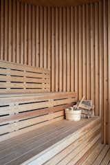 Bath Room, Medium Hardwood Floor, and Wood Counter HOTSPOT by Oslo Works Communal social seating.  Photo 5 of 16 in HOTSPOT for cool sauna communities by Per Asbjørn Risnes Jr.