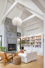 Vaulted living space with cast concrete fireplace.