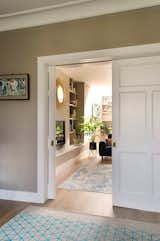 The charm of the original sliding pocket doors is preserved and celebrated, offering a vintage touch to the living spaces. Carefully refurbished and retained, they serve as flexible dividers, allowing seamless transitions between open and separated areas. Enjoy appealing views through interconnected spaces.