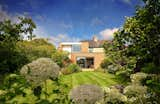 Deep splayed brick reveals capture as much sunlight as possible while the splayed soffit offers protection from the elements without limiting views to the garden beyond.