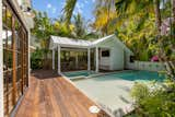 Custome heated pool with a splash pad and spa