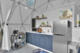 Kitchen, Colorful Cabinet, Refrigerator, Vinyl Floor, Engineered Quartz Counter, Drop In Sink, and Microwave Kitchenette  Photo 7 of 9 in Out Of This World Geo Dome by Garrett Brown
